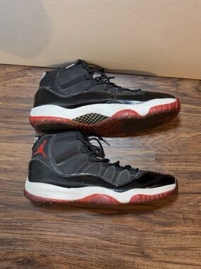 Jordan Men’s Black/Red/White Air Jordan 11 Retro Athletic Shoes